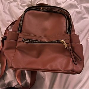 Dusty pink/mauve mini backpack.  Lightly used.